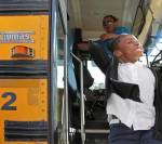 CHILD STEPPING OFF BUS MIAMI HERALD